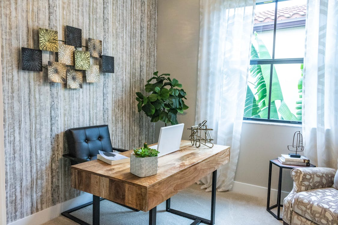 modern home office with desk and natural light showing does a home office add value