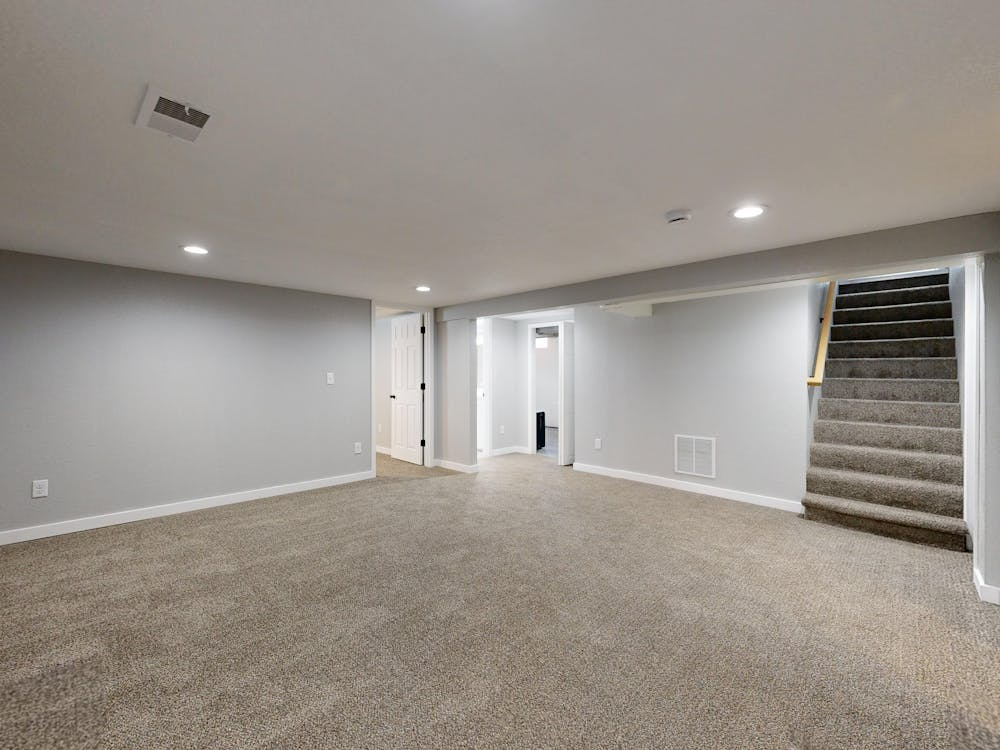 finished basement living space illustrating does finishing a basement increase value